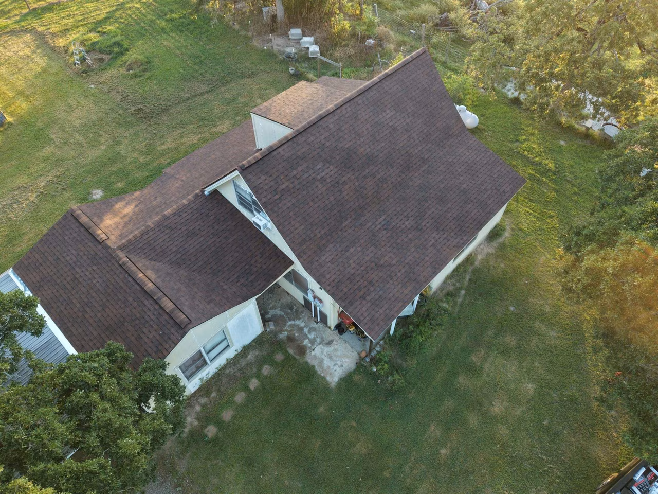 Aerial view of a brown shingle roof on a home