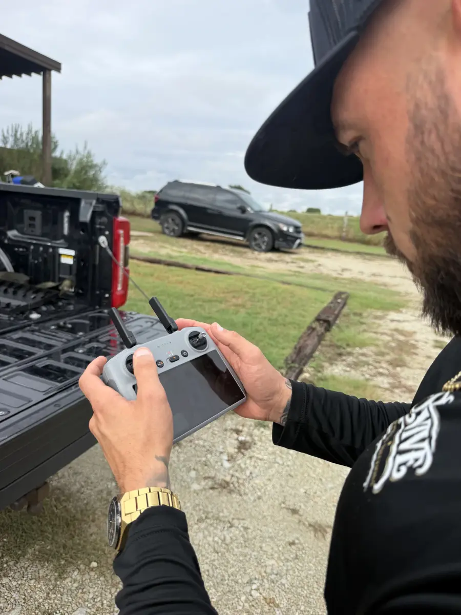 Revive team member flying a drone to inspect a roof