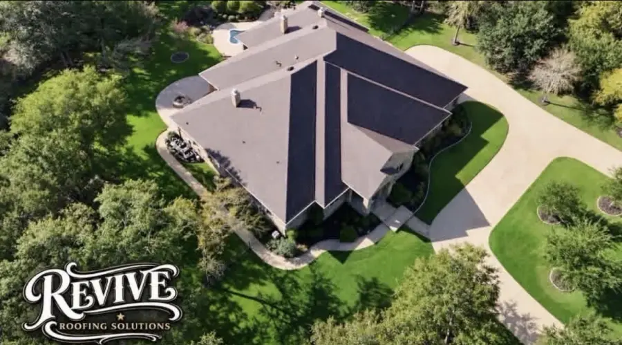 Aerial view of a luxury home with a new architectural shingle roof