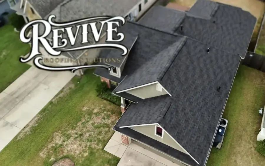 Aerial view of a newly installed dark shingle roof