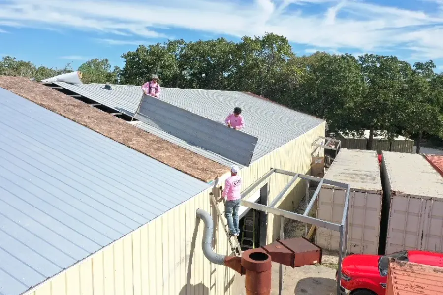 Revive crew member working on a commercial roof repair